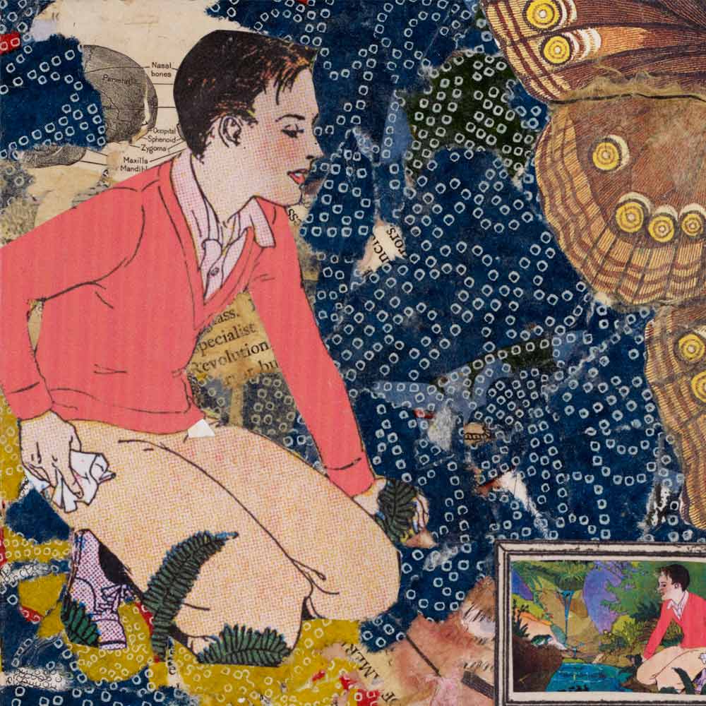 boy kneeling in the grass looking down at a mirrored painting